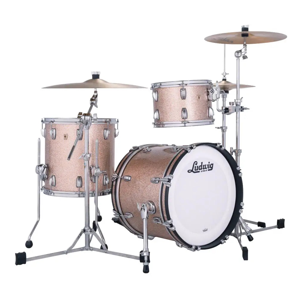 Ludwig drum kit with a glittery rose gold finish, chrome hardware, and a white bass drum head, shown on a solid white background.